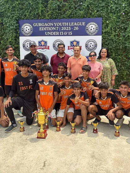 Champions! Our undefeated U15 team celebrates their Gurgaon Youth League victory with coaches and proud parents. This picture captures our winning culture and the strong community we've built at the academy.