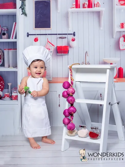 Turning your child's dream into a photograph is what my creative shoots are all about. This little one wanted to be a chef, so we created a miniature kitchen set where his personality could shine.