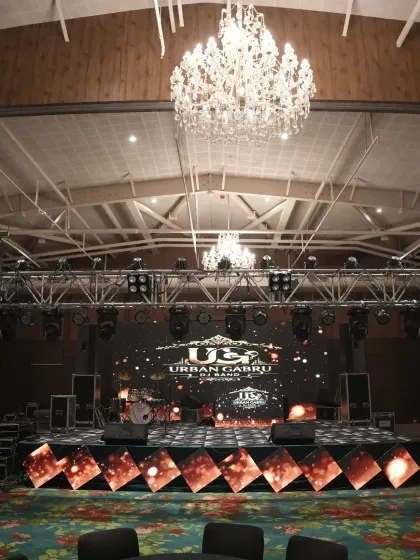A direct view of the stage and technical setup for a large-scale musical performance. We manage all aspects of stage fabrication, sound systems, and dynamic LED screens for entertainment segments.