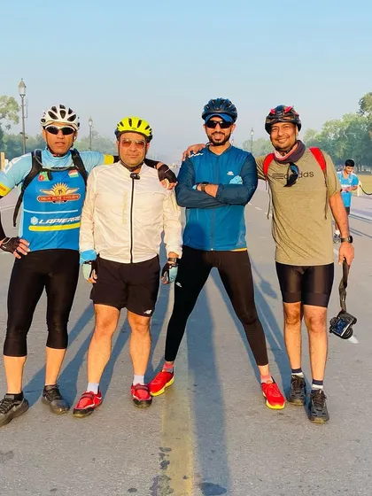 The group posing on the road. We are a team, and we own the road together.