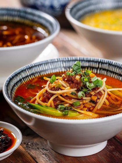A bowl of Dan Dan noodles, a spicy Sichuan noodle soup, shot for the Shang Palace menu.