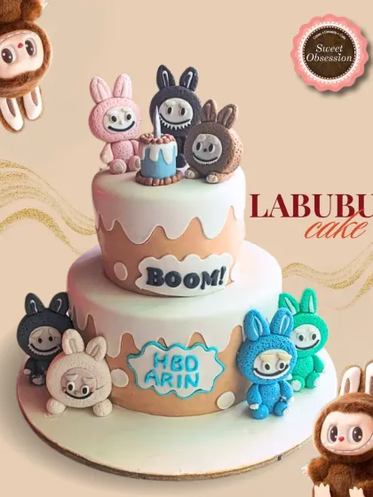 A playful and unique two-tier Labubu cake, surrounded by colorful, quirky character figures for a fun and modern birthday party.