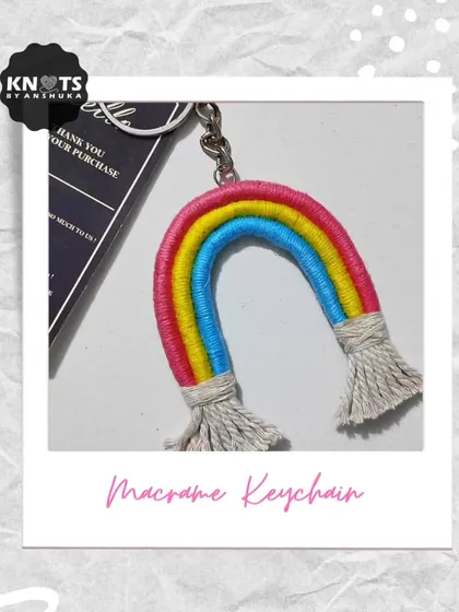 My macrame version of a rainbow keychain, made by wrapping colorful yarn around cotton rope and adding fluffy tassels at the ends.