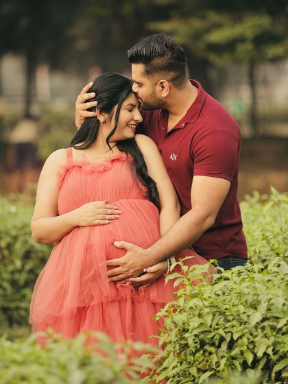 A tender moment of love and connection. This close-up shot shows the beautiful texture of the gown and the couple's happiness.