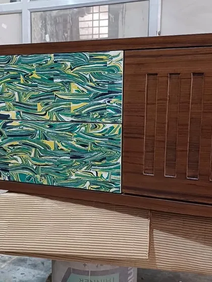 A custom console table in progress, featuring panels made from recycled materials with a vibrant green marbled effect. This piece showcases my commitment to sustainable design and creative reuse.