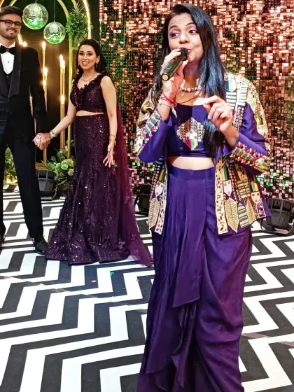 Interacting with the couple on stage during their Sangeet. My goal is to make them feel comfortable and celebrated throughout the evening.