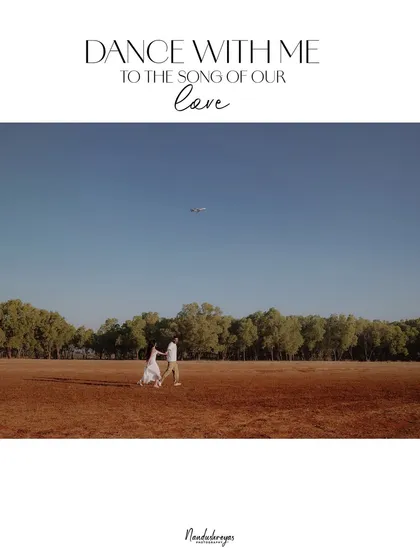 A wide shot of a couple dancing in a vast, open field under a clear blue sky, capturing a feeling of boundless joy and freedom.