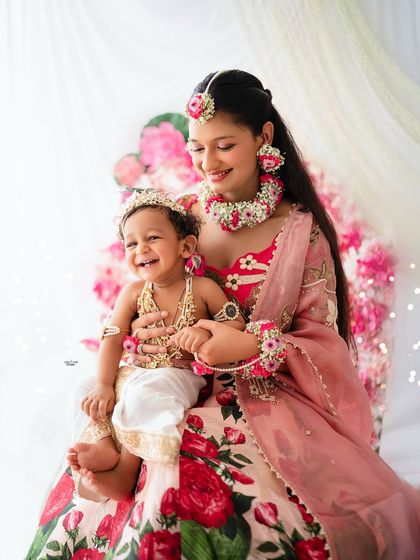 A joyous moment between a sister and her baby brother, both dressed beautifully for this Janmashtami themed shoot. The love and happiness here are just wonderful.