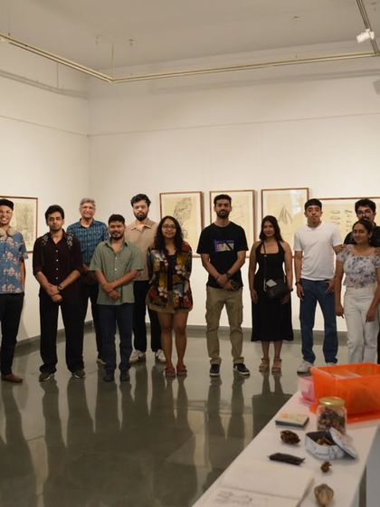 A group photo of visitors and the artist at the 'Bring me Flowers' exhibition.