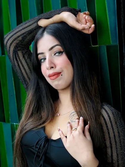 This close-up portrait has a strong, confident feel. The pose and direct gaze are perfect for creating an impactful social media post that grabs attention.