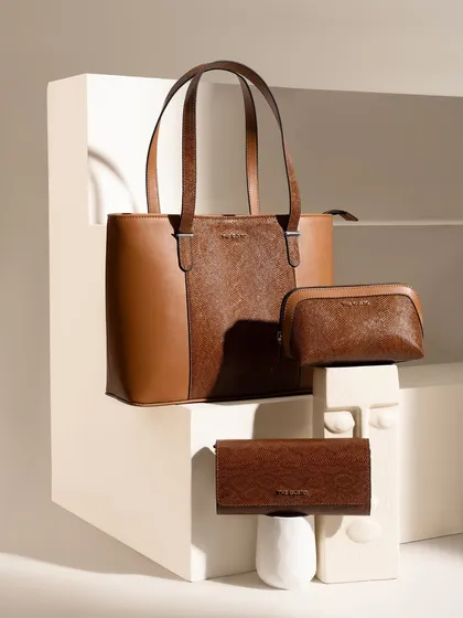 A great handbag shot is about more than just the bag; it's about the composition. Here, we used clean architectural props and balanced lighting to create an elegant product family shot, highlighting the texture and form of each piece.