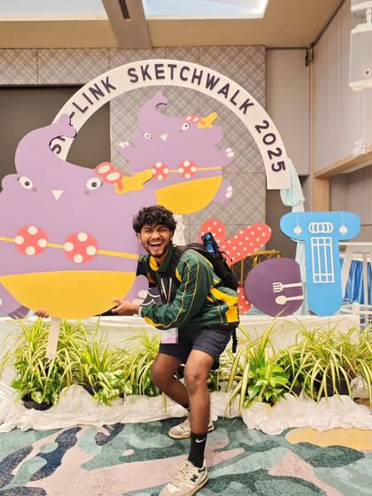 Posing with the fun mascot at the Asia-link Sketchwalk 2025 event in Phuket.