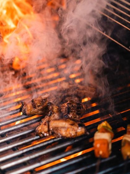 The heart of our barbecue is the flame. We use live fire to grill meats and skewers to perfection, infusing them with a smoky flavor that is simply irresistible.