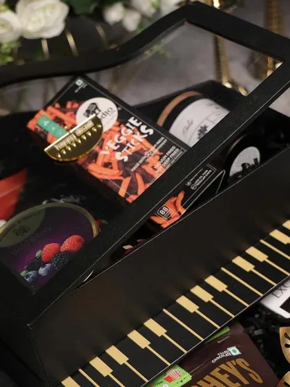 A unique piano-shaped gift box for a music-loving client. Thinking outside the box with creative packaging is a great way to make your gifting business stand out.
