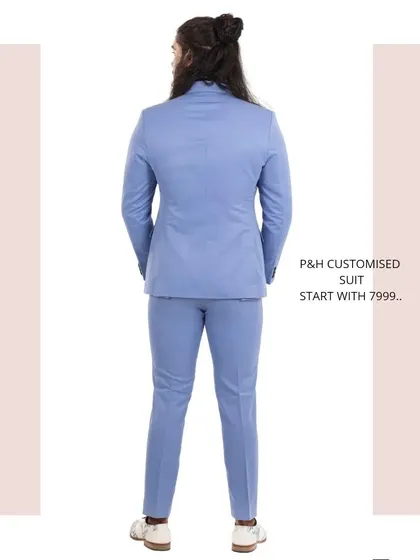 The back view of the sky blue suit, demonstrating the clean lines and precise fit.