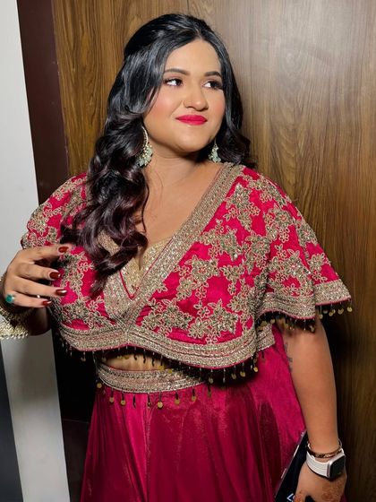 Another angle of this fun party look. The red nails perfectly match her lipstick.