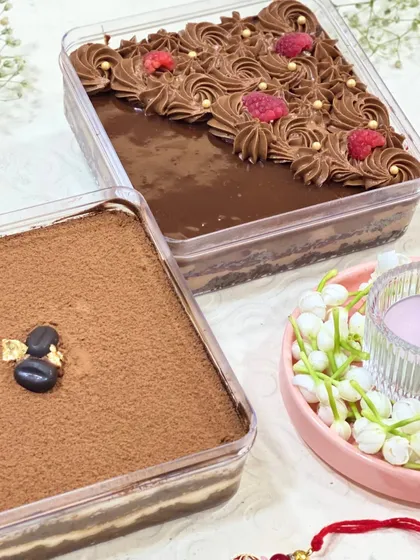 My two most popular dessert tubs side-by-side: the classic Tiramisu and the rich Raspberry Chocolate. They are a perfect treat for any occasion.