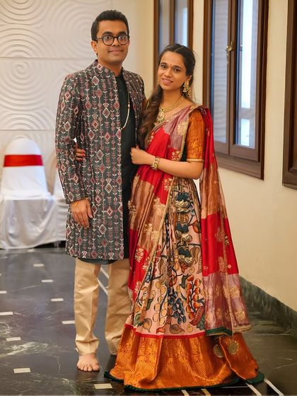 A modern take on a traditional wedding pooja look. This outfit combines classic motifs with a high-rise neck and a sleek, modern cut for a groom who wanted the best of both worlds.