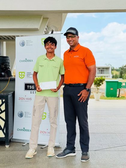 A smiling winner receives his prize. Our tournaments are not just about competition; they are about creating positive and memorable experiences.
