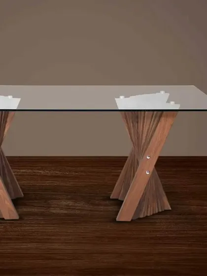A dining table with a clear glass top that showcases its intricately designed twisted wooden base.