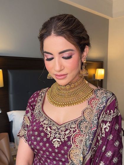 A close-up of the eye makeup. The colors are rich and vibrant, yet softly blended for a seamless finish.