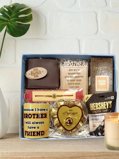 This Rakhi hamper for a brother is full of warmth and affection. It includes a 'Best Brother' wallet, a special mug, perfume, chocolates, and a rakhi, all beautifully arranged.