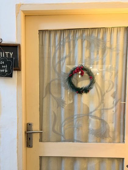 Even the doors get a festive touch. A simple wreath and a "Please do not disturb" sign on the beauty room door ensure your holiday treatment is peaceful.