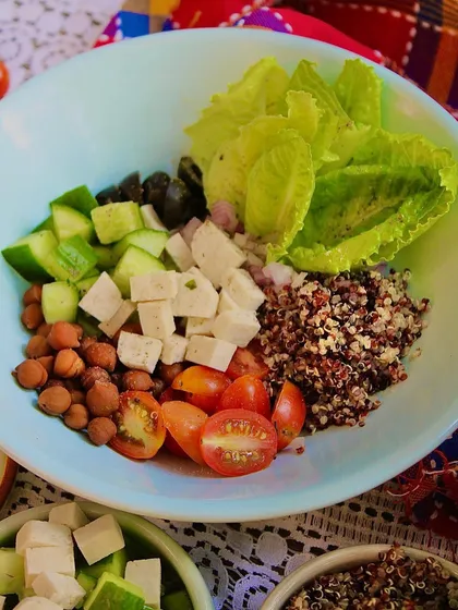 The ingredients for our High Protein Salad Bowl, deconstructed. You can see the freshness of the organic quinoa, black chana, silken tofu, and crisp vegetables before they come together in a delightful meal.