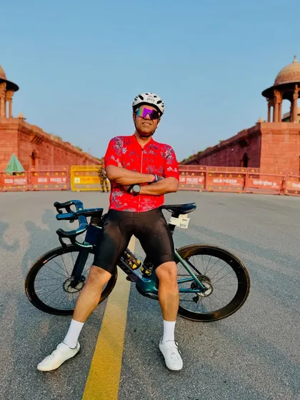 A confident pose with a beautiful bike.