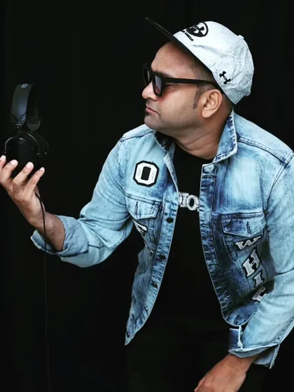 A different look, featuring a denim jacket and a confident pose with my headphones. I believe a DJ's style should be as dynamic as their music.
