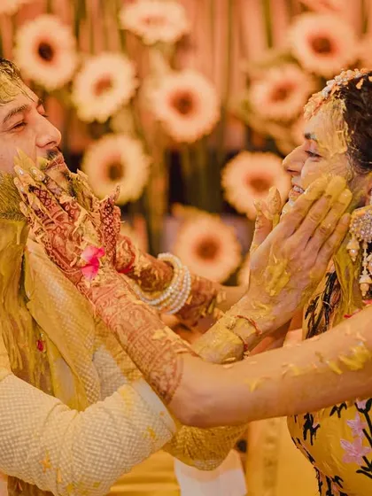 A candid shot capturing the sheer fun of a Haldi. I design the event flow to encourage such natural interactions, ensuring the couple and their families have the time of their lives.