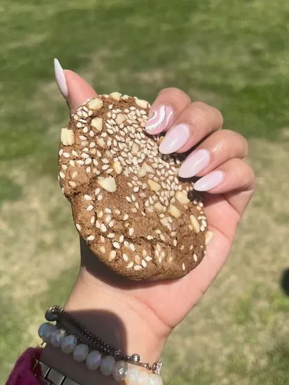 A happy client, Ishani, sent me this lovely photo of her new nails. The soft pink base with a delicate white swirl looks so chic and perfect for her style.