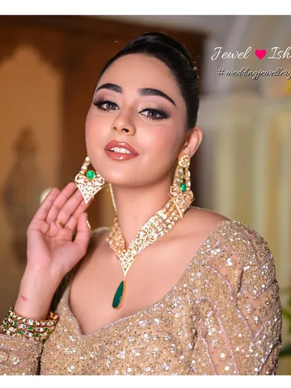 A close-up of our Moissanite Polki collection, where traditional craftsmanship meets modern design. Notice the rich green emerald drop that adds a pop of colour to the intricate Polki work. This set is perfect for a Sangeet or reception, giving you a regal look with a contemporary feel.