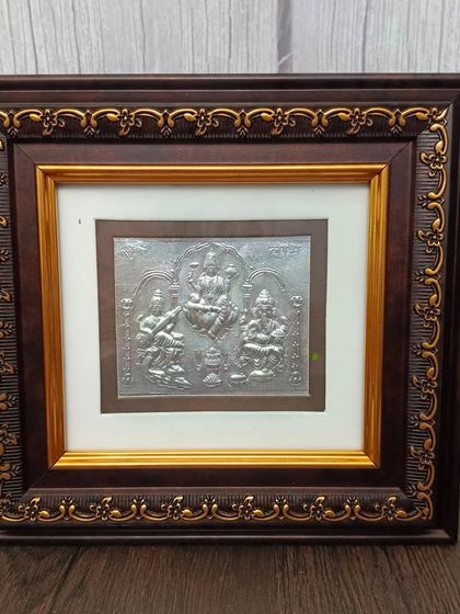 This 999 pure silver frame features Ram, Lakshman, Sita, and Hanuman, a classic Ram Parivar depiction for your home.