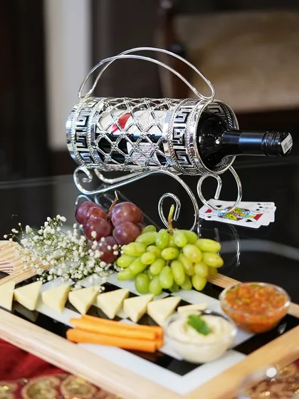A full view of the festive table setup, where my wine holder serves as an elegant centerpiece. It is a perfect accessory for house parties and holiday gatherings.