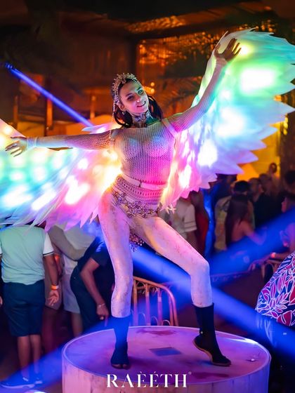 Our LED Angel performs on a raised platform, creating a heavenly vision above the crowd. The rainbow-colored wings and dramatic pose make for a perfect photo opportunity at any event.