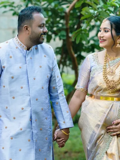 A maternity portrait doesn't always have to be posed. This candid moment of a couple sharing a look during a walk shows the beautiful, quiet connection of expecting parents. I love capturing these simple, real emotions in traditional attire.