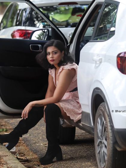Using a car as a prop for a modern, stylish outdoor portrait. It adds a narrative element to the lifestyle shoot.