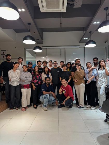 A group photo of students and trainers after a successful advanced haircut workshop. This captures the collaborative and celebratory spirit of our academy.