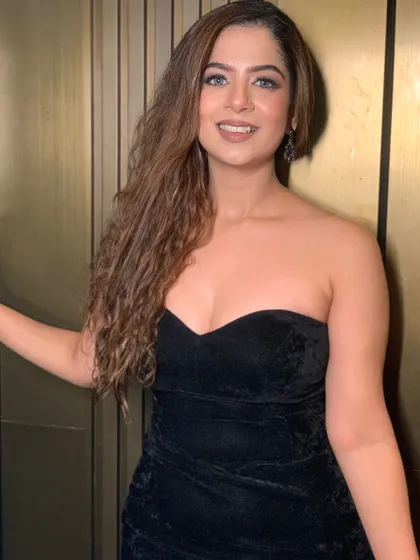 A confident portrait in the black gown.