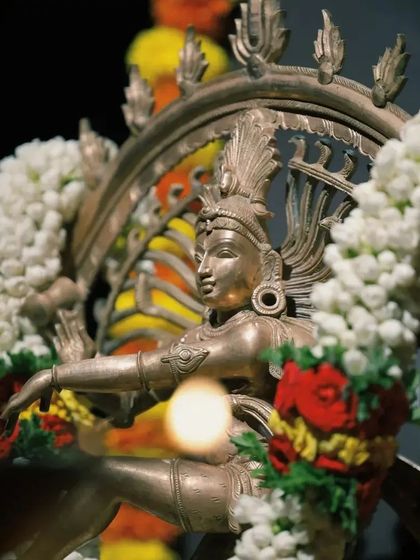 We begin every auspicious performance by invoking the blessings of Lord Nataraja, the cosmic dancer. This decorated idol was the centerpiece at my student's debut.