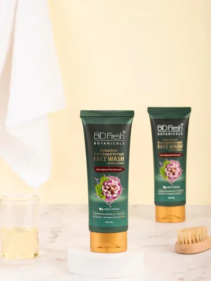 A clean, bathroom-setting shot of Biofresh Botanicals' face wash. The use of a white towel and simple props creates a fresh, hygienic, and minimalist look.