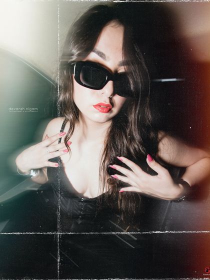 A close-up shot from the vintage car series, focusing on the bold red lip and sunglasses.