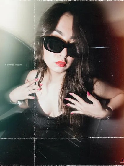 A close-up shot from the vintage car series, focusing on the bold red lip and sunglasses.