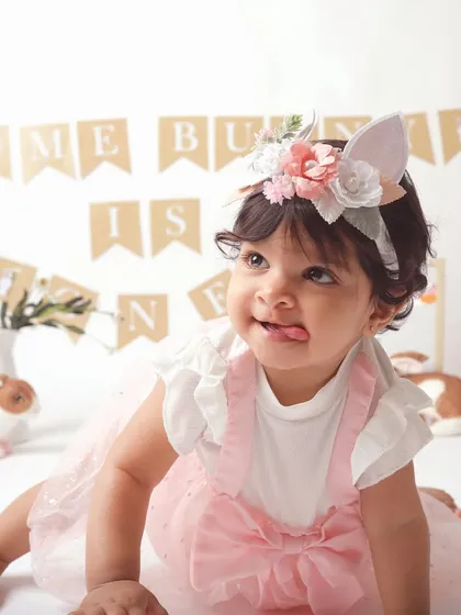 A cheeky expression from our little bunny. Themed shoots are a wonderful way to showcase your child's personality.