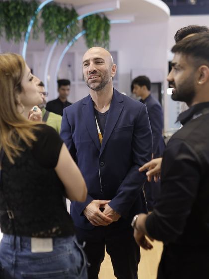 Sussanne Khan networking with international exhibitors and designers, reflecting the global nature of our expo community.