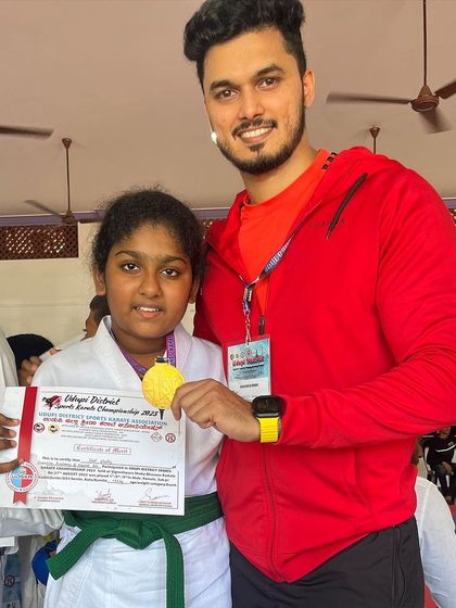 This student's gold medal is a result of her dedication in our kids' karate program.