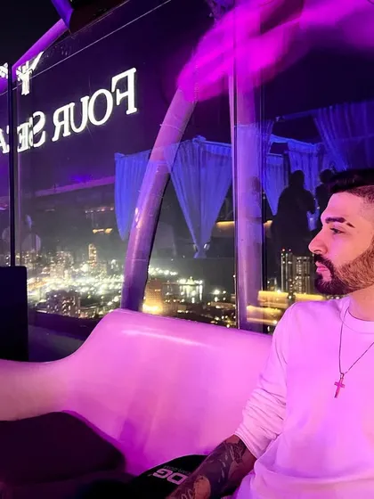 Taking a moment at Aer Lounge at the Four Seasons, Mumbai. Playing at premium, iconic venues with stunning city backdrops is part of the experience I offer.
