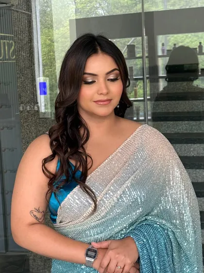 A close up of the shimmering eyeshadow for this party look. The blend of silver and a hint of blue creates a stunning, multi-dimensional effect.