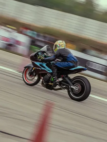 A custom drag bike with a distinctive blue and black livery. These purpose-built machines are engineered for one thing only: maximum acceleration.